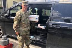 Military member with care package