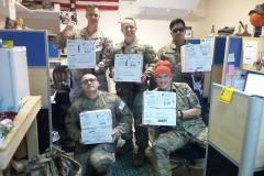 Photo if military members with care packages