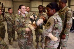 Military members with bear care package